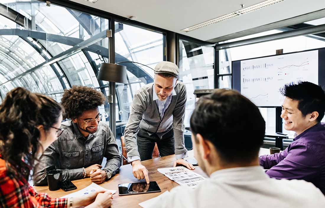 Two professionals looking at computer