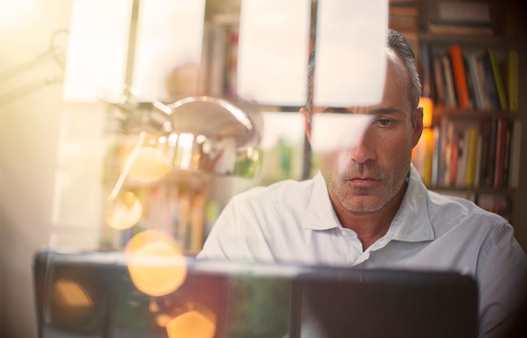 Image of man at computer