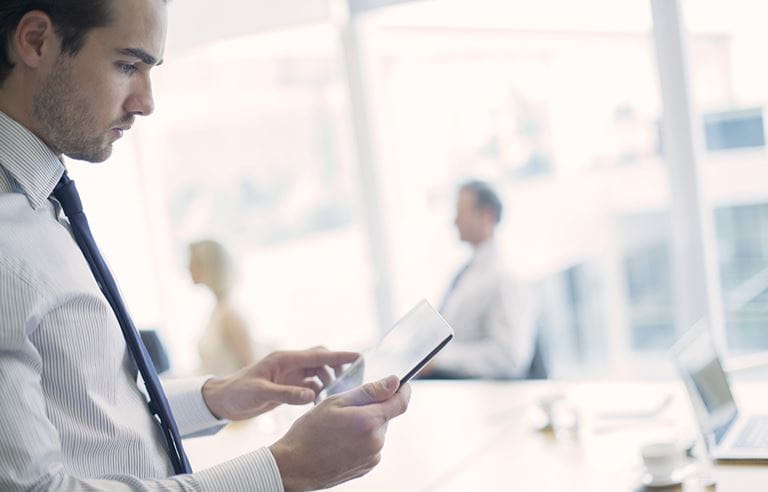 Image of a man reviewing information 