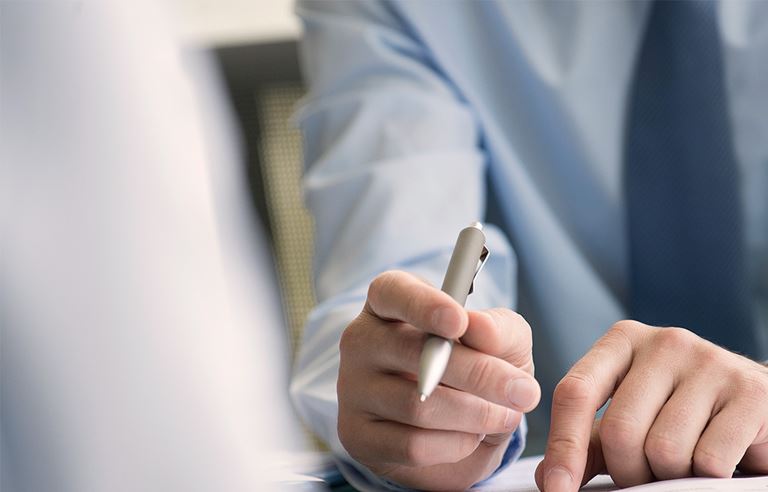 Image of man writing