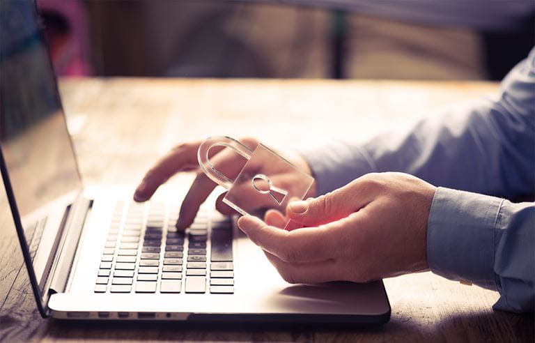 Image of lock and person on computer