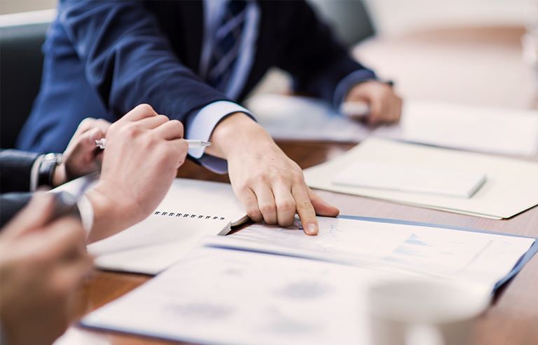 Man pointing at day planner