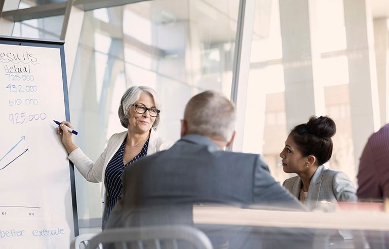 business people planning on a white board