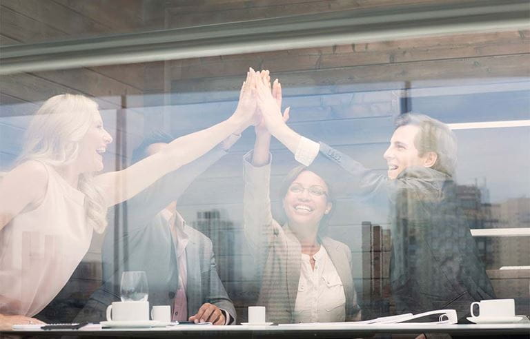 Image of team giving high five