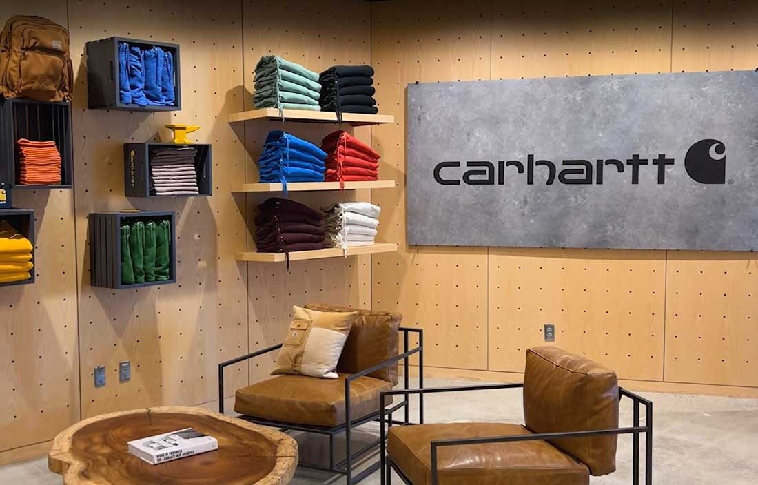 Interior photo of one of Carhartt's stores with Carhartt apparel on the shelves