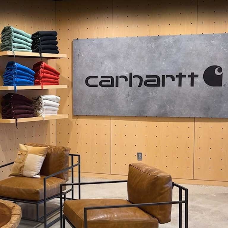 Interior photo of one of Carhartt's stores with Carhartt apparel on the shelves