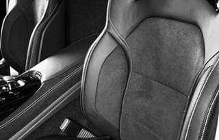 Leather front seat of car.