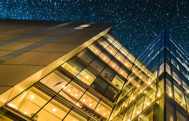 lit office building at night 