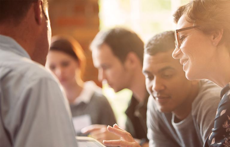 closeup of team members faces when working 