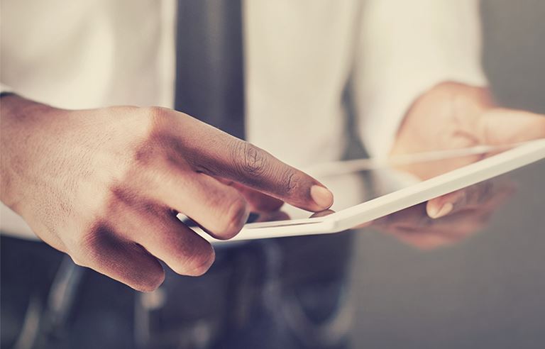 closeup of man on a tablet