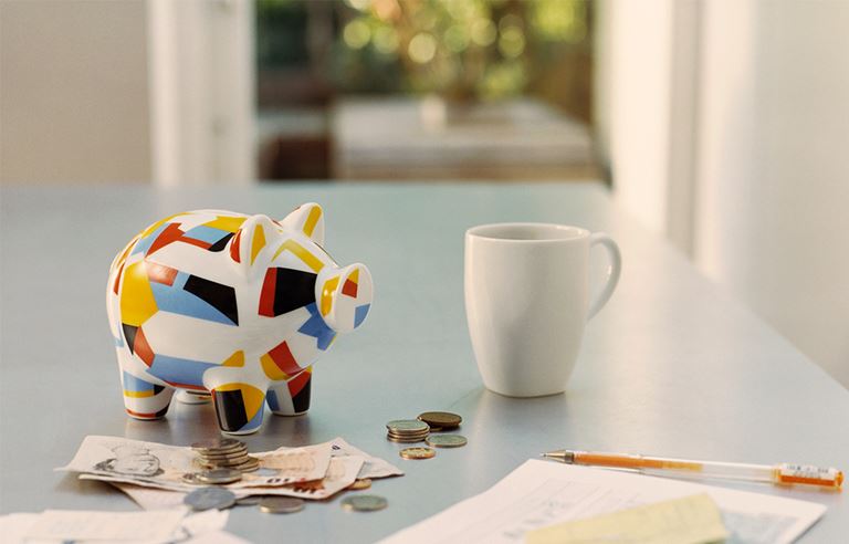 desk with multicolored art decco piggy bank