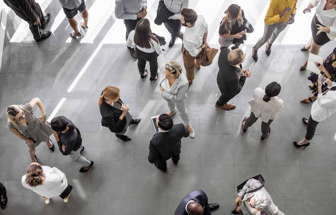 Top down view of conference attendees talking.