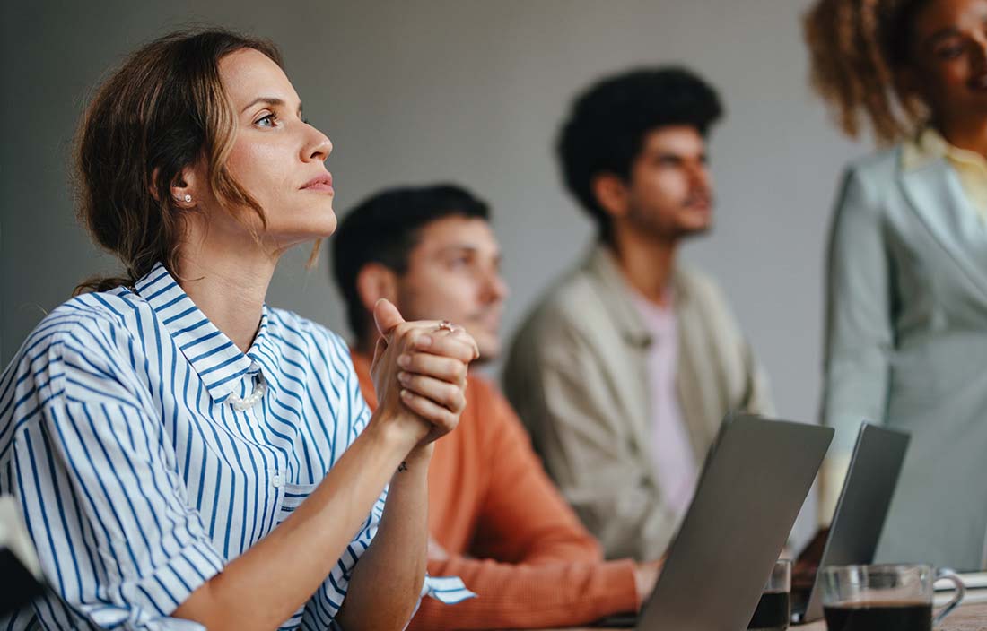 Business professional attending a conference on employee retention credits.