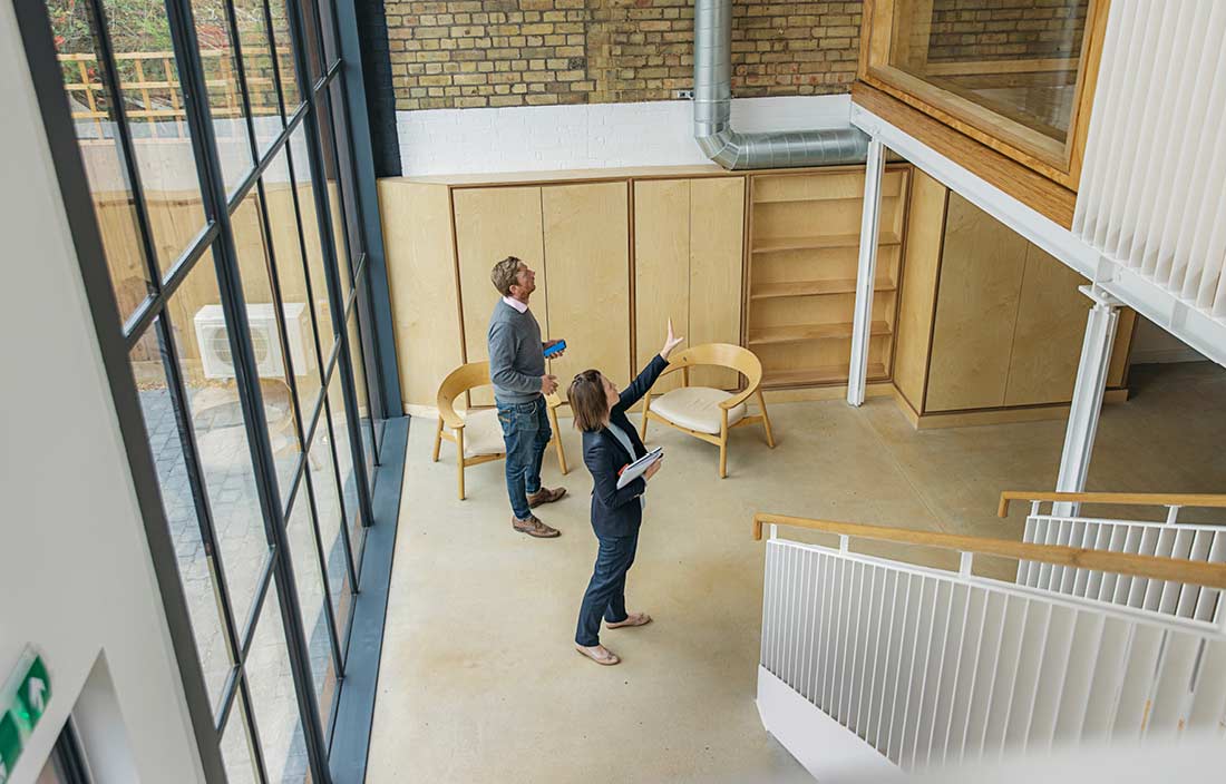 Real estate professionals assessing a building.