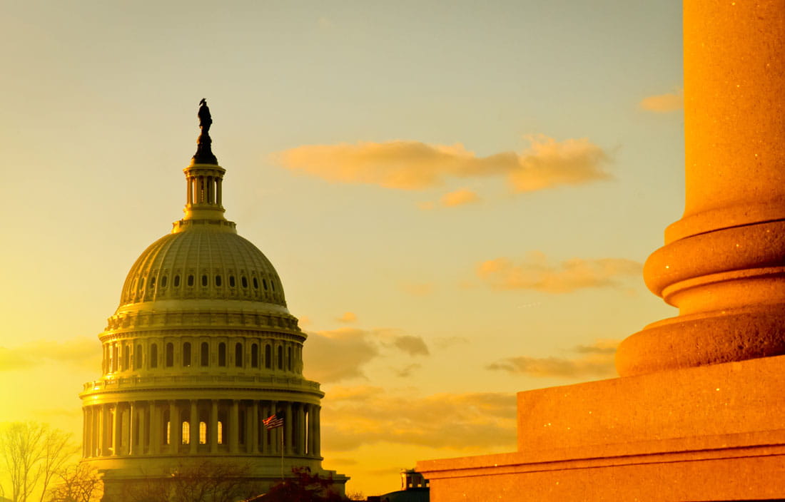 View of U.S. Congress building at sunrise.