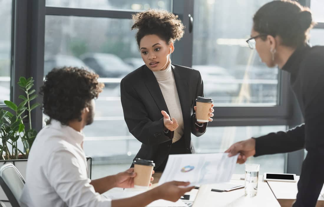 Business professionals discussing the Inflation Reduction Act.