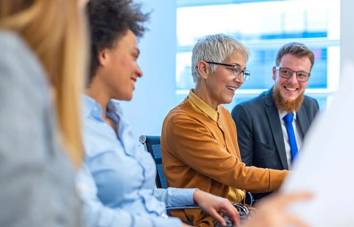 Business professionals discussing IRS exams.