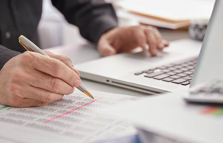 Government professional referring to their notes.