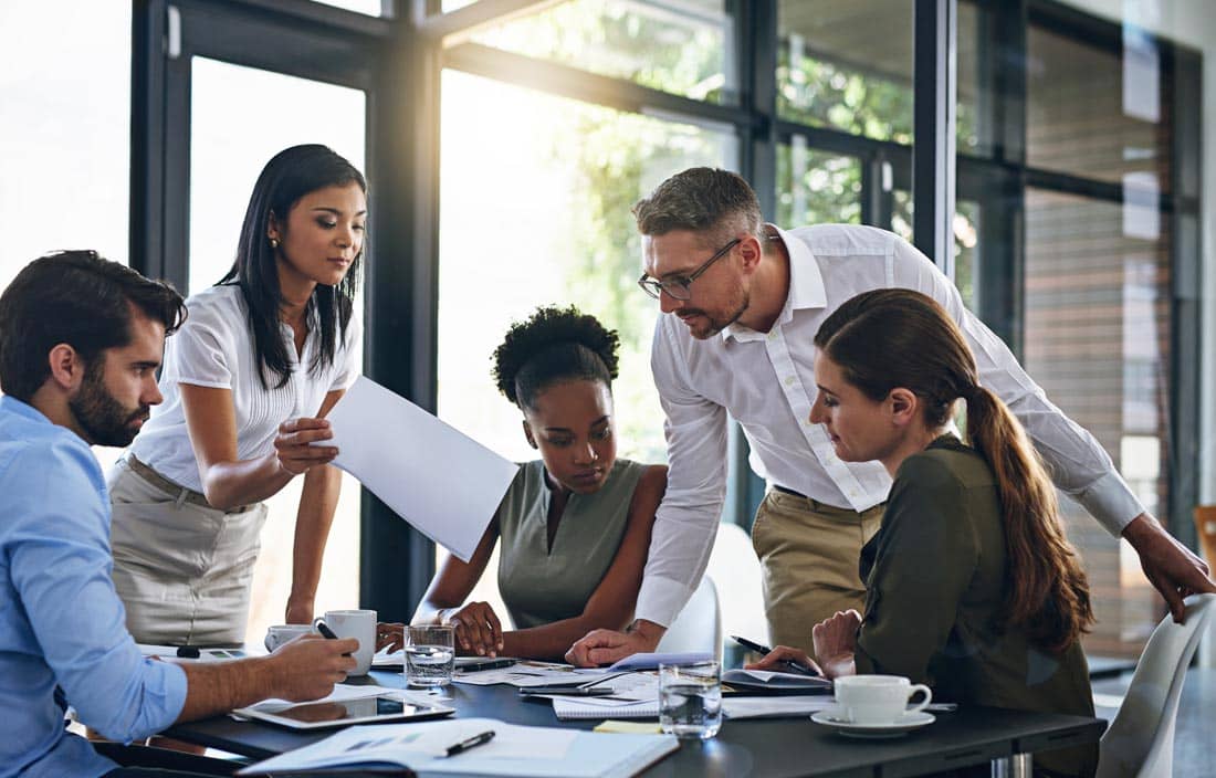 Group of business professionals discussing international tax.