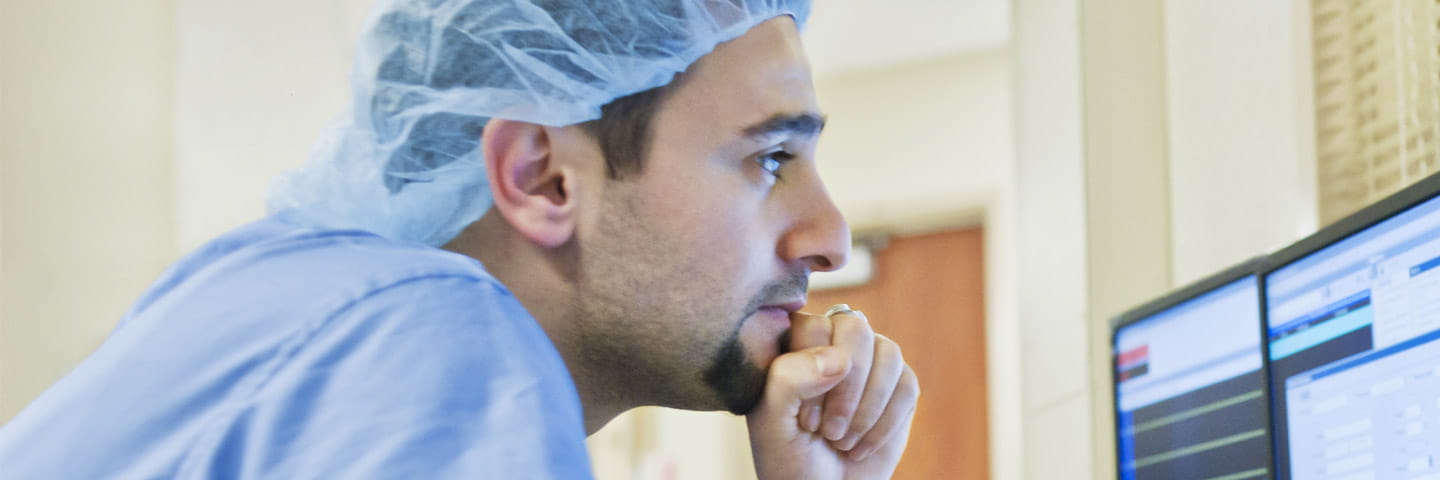 Medical professional looking at their computer.