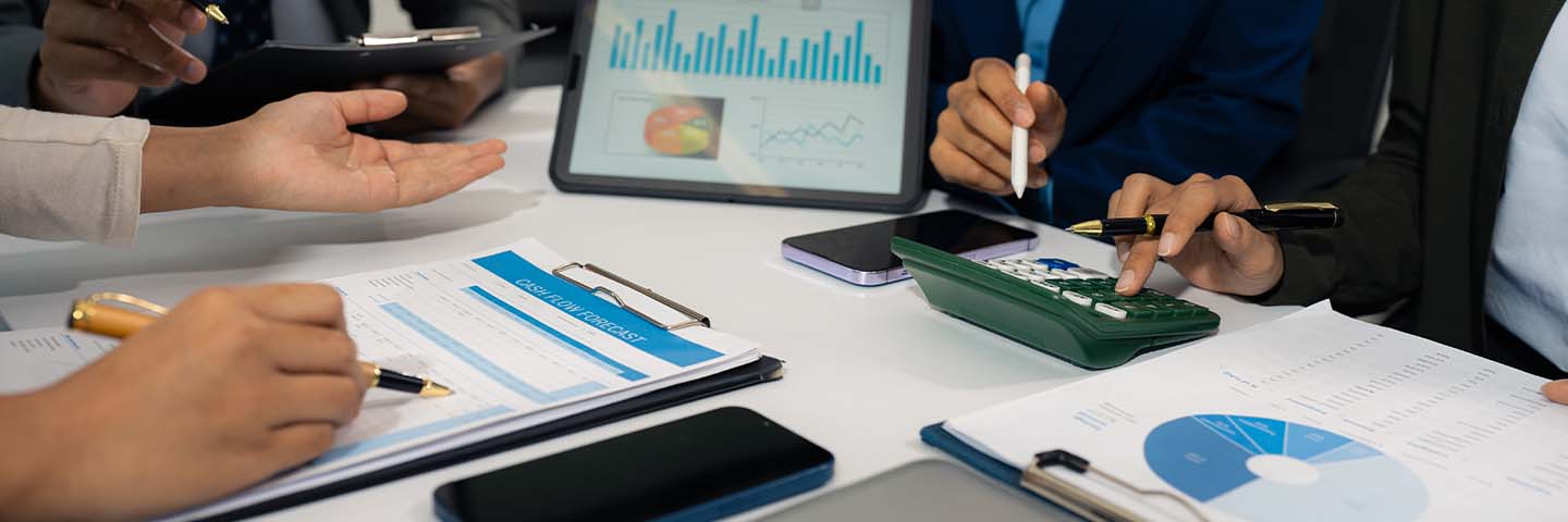 Financial professionals reviewing charts and graphs.