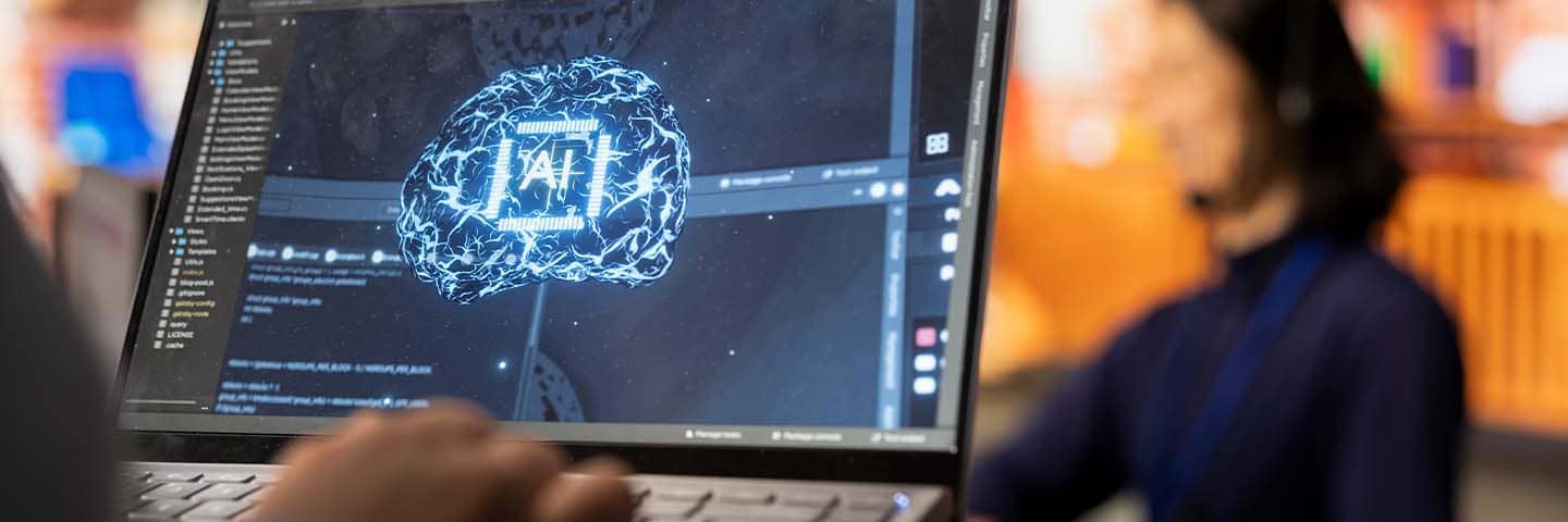 Business professional learning about AI on their computer.