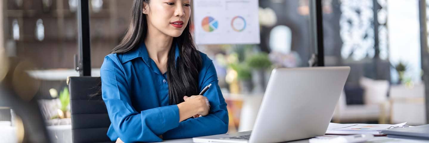 Financial advisor looking at data on their laptop.