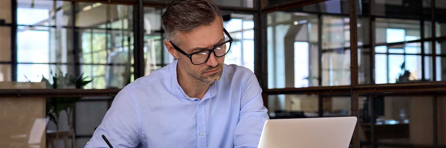 Business professional reading about the unemployment rate.
