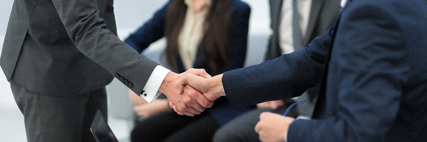Businesspeople shaking hands.