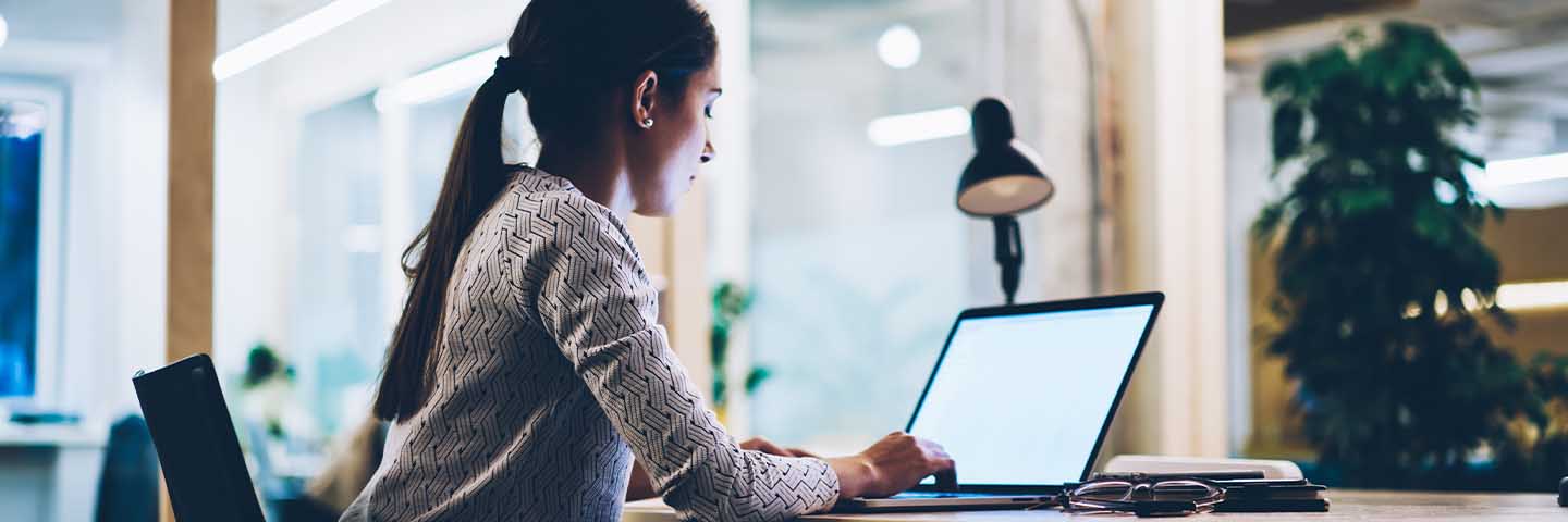 Financial advisor working on their laptop computer.