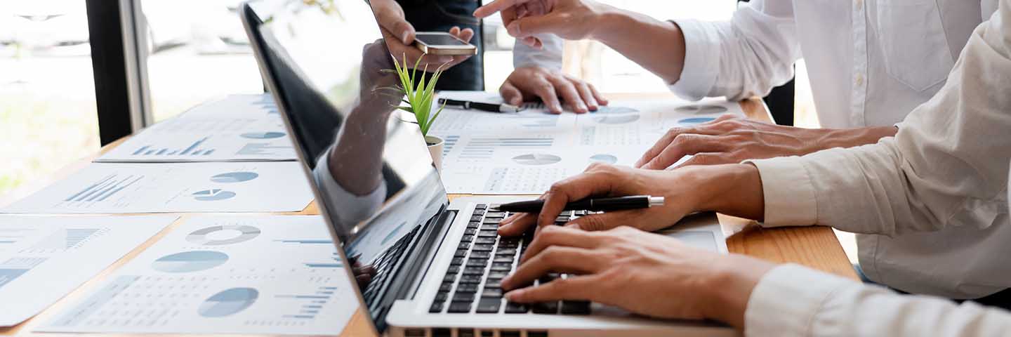 Close-up photo of hands on a laptop computer