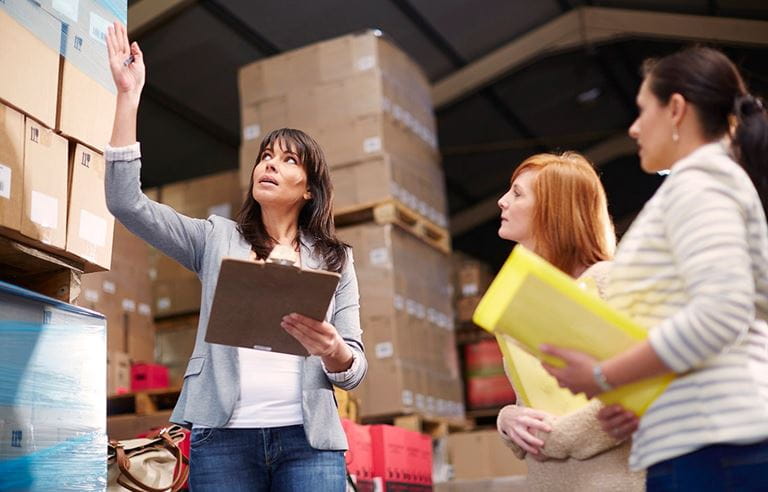 People pointing at boxes