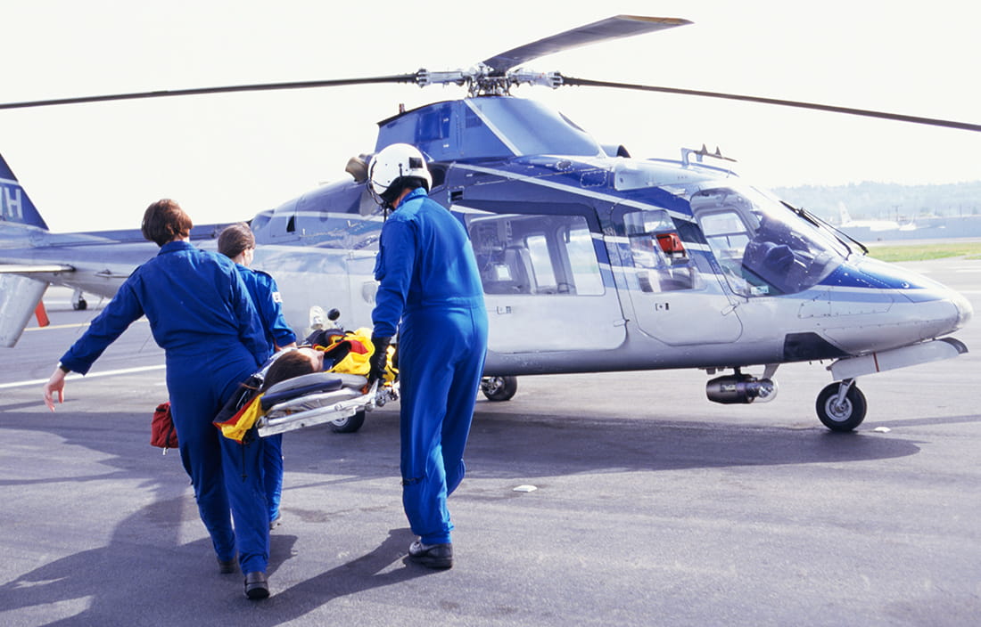 Photo of medical personnel performing an emergency medical airlift. 