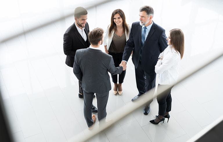 Business people meeting in hallway