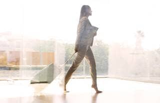Woman walking through airport