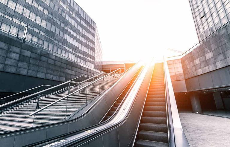 Staircase and escalator in a downtown business area. 