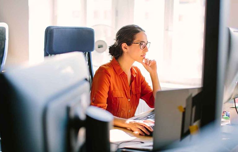 Woman sitting at a computer