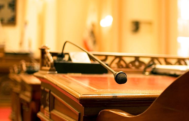 Close up view of a podium and microphone.