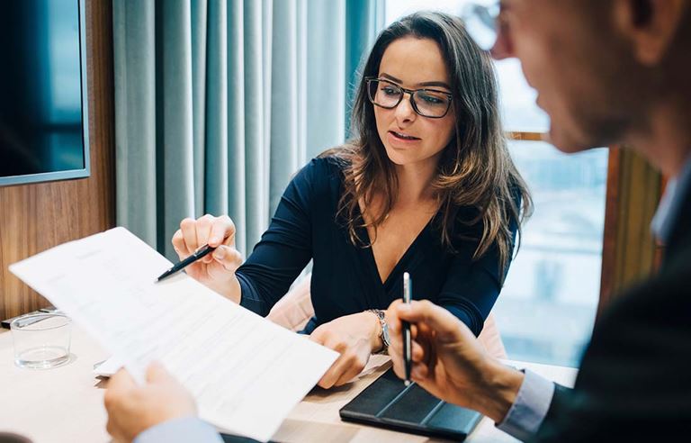 Business professionals reviewing documents together.