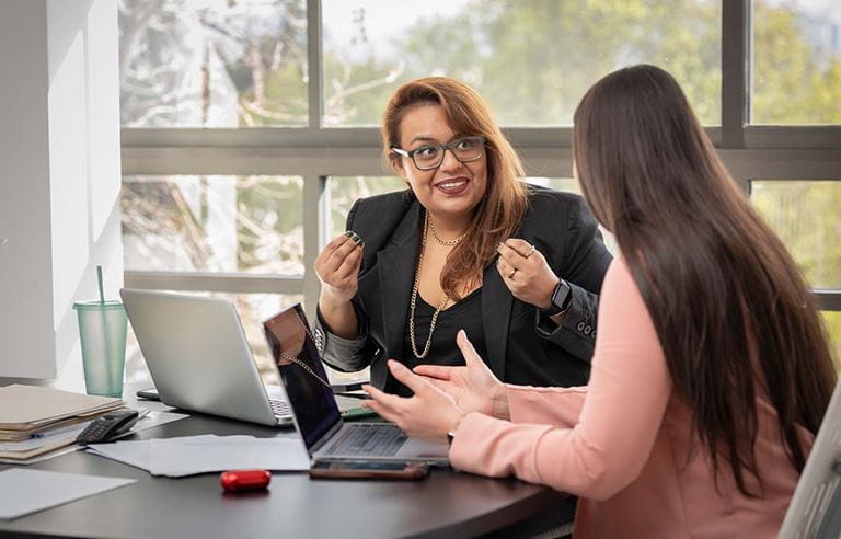 Accountant discussing how to navigate Section 460 with their client.