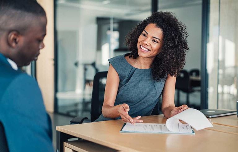 Employee benefits consultant discussing prescription drug data collection with their client.