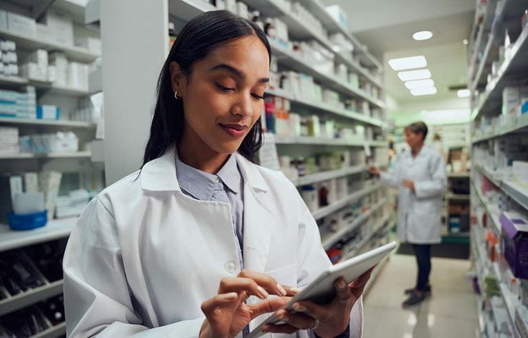 Healthcare professional looking at inventory on their tablet computer.