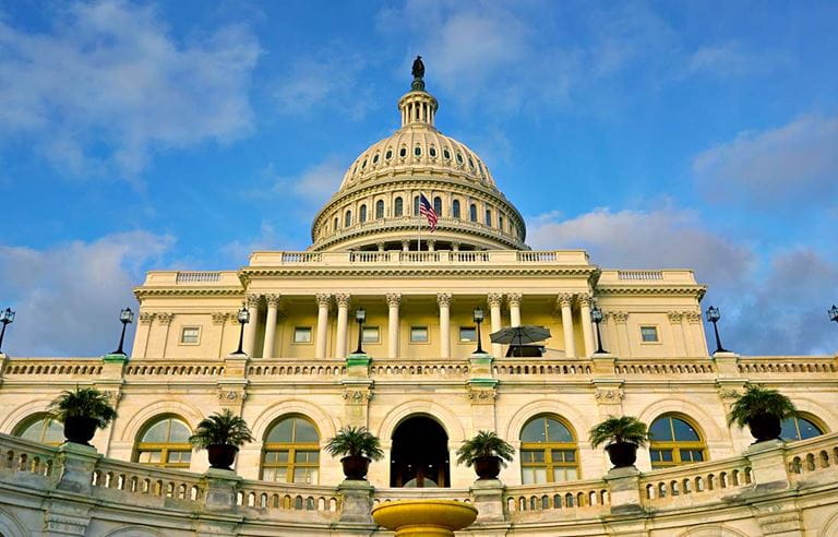 View of U.S. Capitol against the blue sky.