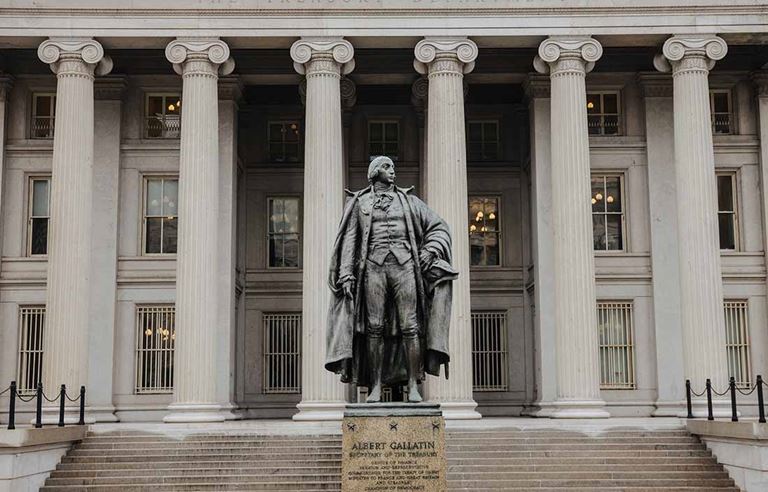 Statue in front of a U.S. government building.