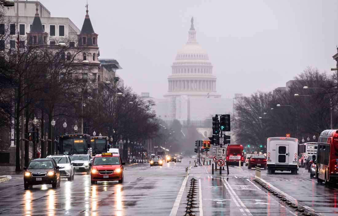 A view of a street in front of the United States Capitol