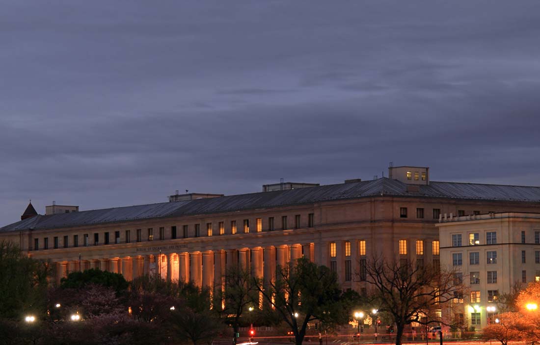 View of U.S. government building at night.