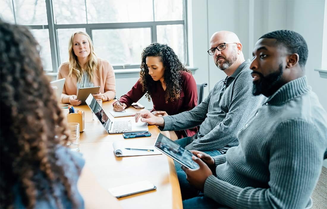 A group of business professionals having a meeting in a conference room