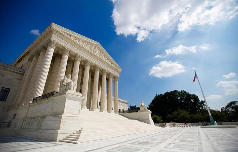 View of U.S. Supreme Court building during the day.