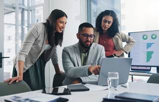 Two professionals discussing uniform guidance with one another
