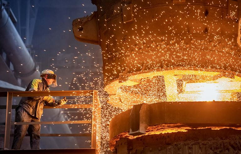 Steel worker in a factory.